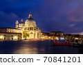 The Basilica of St Mary of Health or Basilica di Santa Maria della Salute at grand canal at night in Venice, Italy 70841201