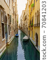 Famous Bridge of Sighs. The enclosed bridge is made of white limestone connect Doge's Palace and new prison. 70841203