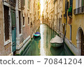 Famous Bridge of Sighs. The enclosed bridge is made of white limestone connect Doge's Palace and new prison. 70841204
