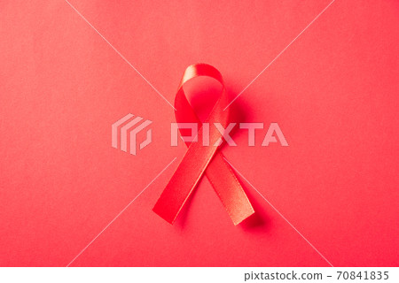 Red bow ribbon symbol HIV, AIDS cancer awareness 70841835