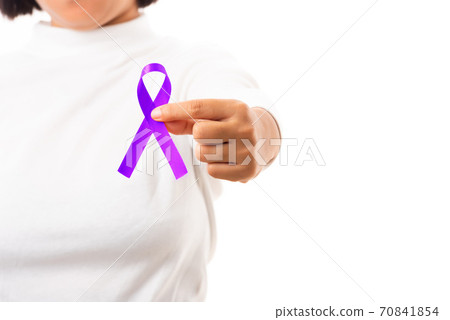 Young woman holding purple ribbon on hand Young woman holding purple ribbon on hand 70841854