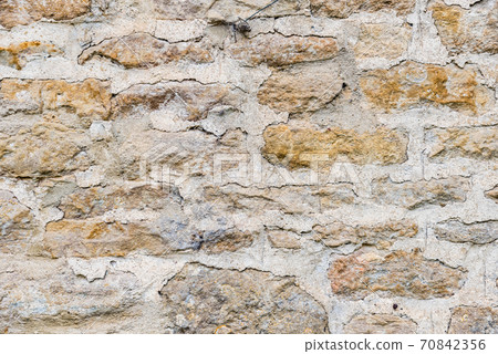 Background material: Stone wall of cottage in Arlington Row, Cotswolds, England Background material: Stone wall of cottage in Arlington Row, Cotswolds, England 70842356
