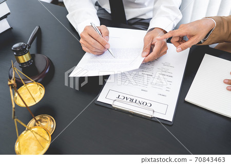 Lawyer or judge present client with contract document papers, Law and Legal services concept Lawyer or judge present client with contract document papers, Law and Legal services concept 70843463