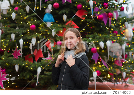 Teen girl walking christmas city Teen girl walking christmas city 70844003
