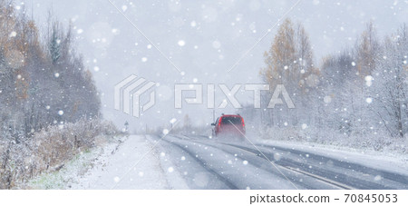 Car is driving on a winter road  70845053