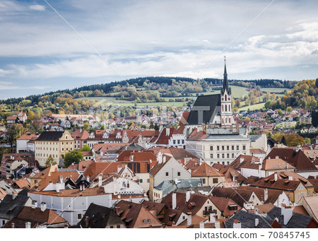 Aerial view of houses and medieval St. Vitus Church in Cesky Krumlov in the Czech Republic Aerial view of houses and medieval St. Vitus Church in Cesky Krumlov in the Czech Republic 70845745