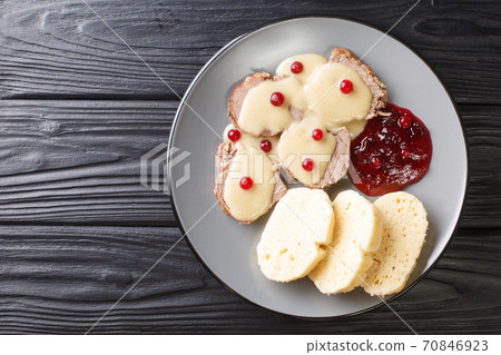 Ultimate Svickova na smetane Recipe Braised Beef with Bread Dumplings close-up in a plate. Horizontal top view Ultimate Svickova na smetane Recipe Braised Beef with Bread Dumplings close-up in a plate. Horizontal top view 70846923