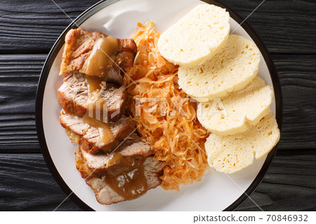 National Dish of Czech Republic Vepro Knedlo Zelo close-up in a plate. Horizontal top view National Dish of Czech Republic Vepro Knedlo Zelo close-up in a plate. Horizontal top view 70846932