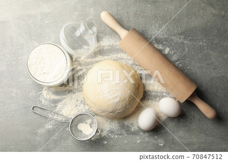 Concept for baking with dough on gray background Concept for baking with dough on gray background 70847512