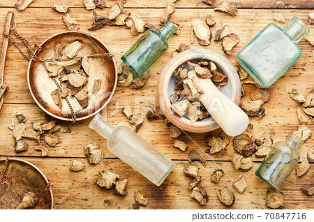 Dried elecampane root on wooden table Dried elecampane root on wooden table 70847716