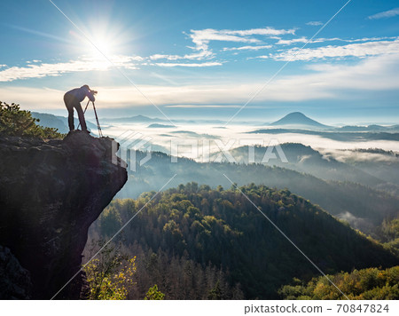 Photographer framing scene in viewfinder. Man use camera 70847824