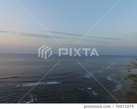 Morning of the sea in Okinawa-Aerial photography with a drone (near Peace Creation Forest Park / Yamagusuku, Itoman City, Okinawa Prefecture) 70851074