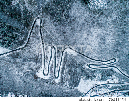 Seasons Concept winter snowy Aerial view Winding road serpentine mountain pass village Brodenbach Germany 70851454