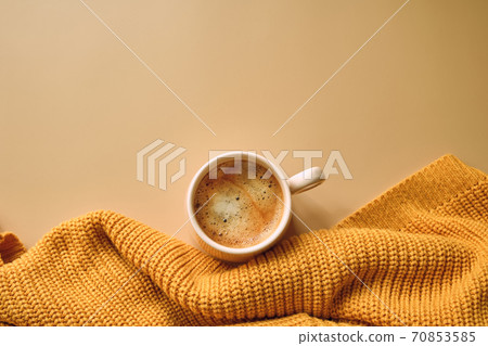 Cup of coffee, yellow sweater. Autumn, fall concept. 70853585