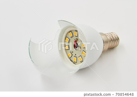 Broken led lamp on a white background Broken led lamp on a white background 70854648