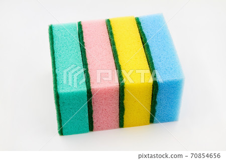Set of multi-colored foam cleaning sponges for washing dishes, cleaning the bathroom and other household needs on a white background. Closeup 70854656