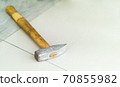 hammer on the stone floor 70855982