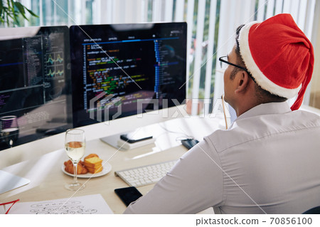 Working in office on Christmas eve Working in office on Christmas eve 70856100