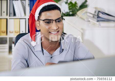 Software developer reading work chat 70856112
