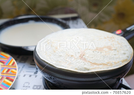 big round pancake on electric frying pan big round pancake on electric frying pan 70857620