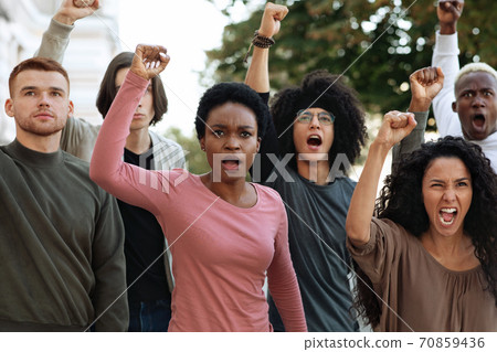 Multiethnic protestors striking against racism on the street Multiethnic protestors striking against racism on the street 70859436