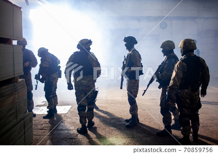SWAT team on scouting mission in industrial area 70859756