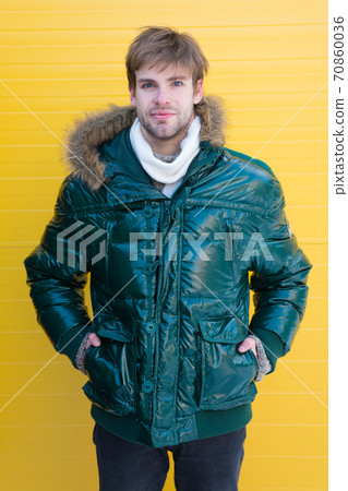 The key to surviving the winter. Handsome man wearing The key to surviving the winter. Handsome man wearing 70860036