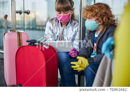 Two children watching the image on the tablet Two children watching the image on the tablet 70861662