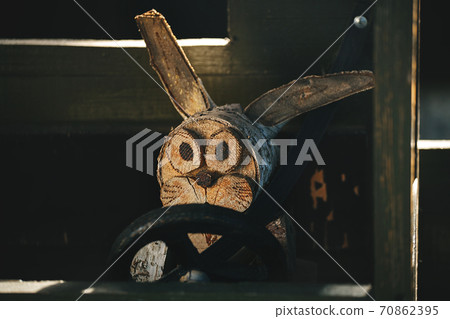 Alert and attentive driver behind the wheel of a wooden truck. Alert and attentive driver behind the wheel of a wooden truck. 70862395