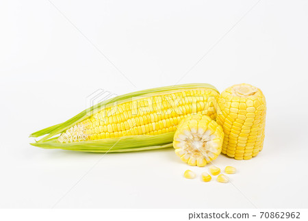 The peeled ear of corn, a piece of and seeds on a white, The peeled ear of corn, a piece of and seeds on a white, 70862962