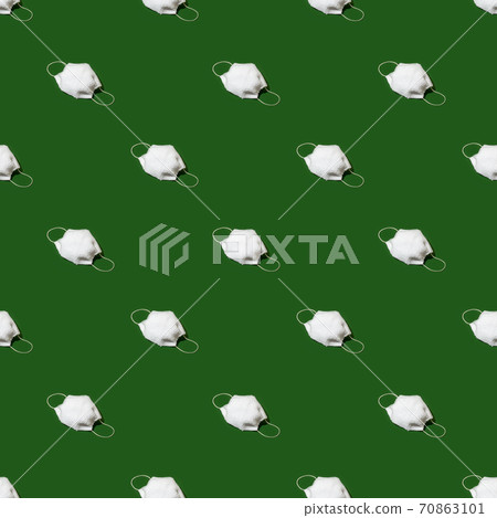 Fur face mask seasmless pattern on natural green background - funny concept, hard shadows. Winter cold Seasonal wearing in pandemic self-isolation, trendy minimal creative idea, new normal 2021 70863101