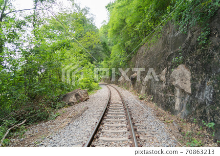 Empty train railway on River Kwai Bridge in Kanchanaburi town, Thailand in public transportation concept. Empty train railway on River Kwai Bridge in Kanchanaburi town, Thailand in public transportation concept. 70863213