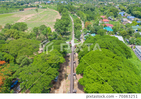 Aerial view of River Kwai Bridge with train rail way with Chao Phraya River, Tha Ma Kham, Mueang Kanchanaburi District, Thailand. Aerial view of River Kwai Bridge with train rail way with Chao Phraya River, Tha Ma Kham, Mueang Kanchanaburi District, Thailand. 70863251