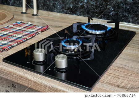 household cooktop with gas burners on 70863714