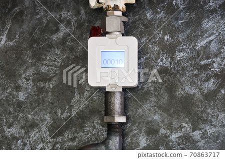 the gas meter is installed on a pipe in the kitchen the gas meter is installed on a pipe in the kitchen 70863717
