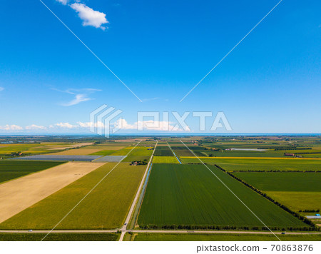 Aerial photo of cultivated fields near seaside resort Caorle at the Venetian Riviera in Italy 70863876