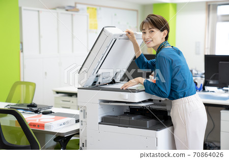 Female employee making a copy 70864026