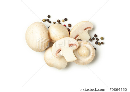 Raw mushrooms and peppercorns isolated on white background Raw mushrooms and peppercorns isolated on white background 70864560