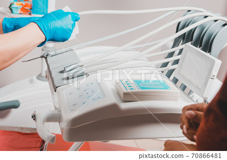 Dental tools close up, dentist tools on a medical table. Cleaning the workplace after treatment of the patient 70866481