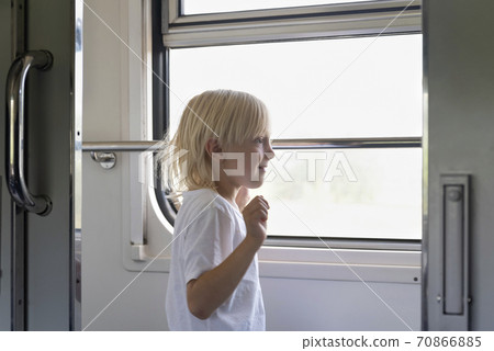 Kids in railway carriage. Boy travels on train. Rail travel Kids in railway carriage. Boy travels on train. Rail travel 70866885