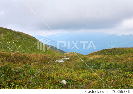 alpine meadows of the Caucasus mountains on a cloudy autumn day alpine meadows of the Caucasus mountains on a cloudy autumn day 70866888