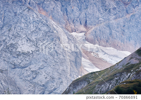 cold alpine landscape with a glacier hidden between the spurs of the mountain cold alpine landscape with a glacier hidden between the spurs of the mountain 70866891