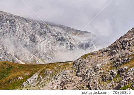 rocky mountain landscape with clouds rising from the gorge rocky mountain landscape with clouds rising from the gorge 70866893