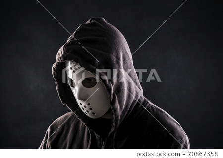 Hooded maniac or criminal in mask Hooded maniac or criminal in mask 70867358