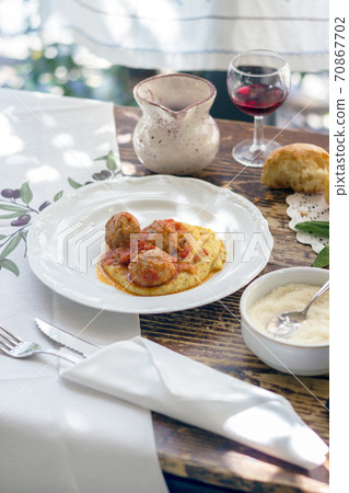 Polenta with meatballs 70867702