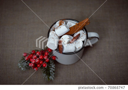 Still life view from above on a mug of hot chocolate and marshmallows. Nearby Is the New Year's decoration. 70868747