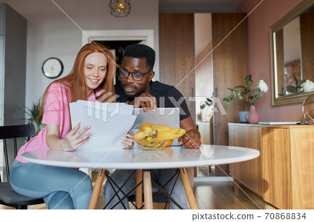lovely diverse man and woman check documents lovely diverse man and woman check documents 70868834