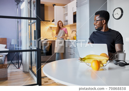 interracial couple in the kitchen, morning interracial couple in the kitchen, morning 70868838