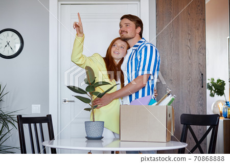 portrait of happy new home owners discussing 70868888