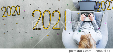 2021 with man using a laptop 70869144